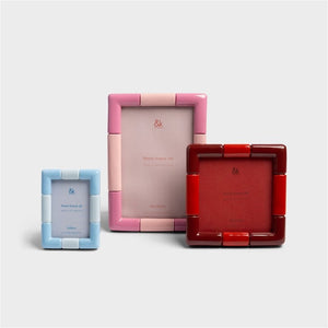 Klevering rift photo frames in blue, pink and red grouped together on a light grey background