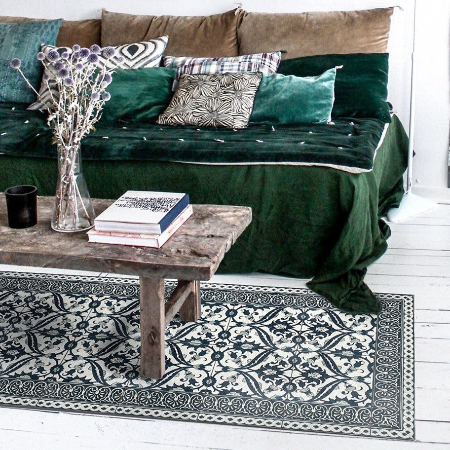 Beija Flor vinyl rug 'Armenian Framed Classic' under furniture in a styled interior space.

