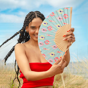 Fisura hand fan shown open with printed design "Swimmers"