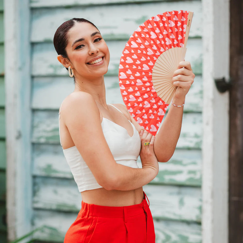 Fisura hand fan shown open with printed design "Hearts" in Red