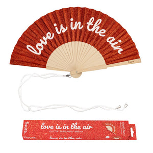Fisura hand fan shown open, featuring  "love is in the air" design on bamboo ribs with a cord