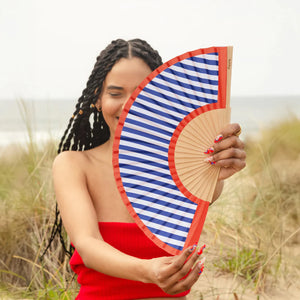 Fisura hand fan shown open with printed design "Red and Blue Stripes".