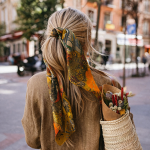 Maison Fanli silk scarf 90x90cm Tropical Temple Ochre worn in hair, styled in Paris street