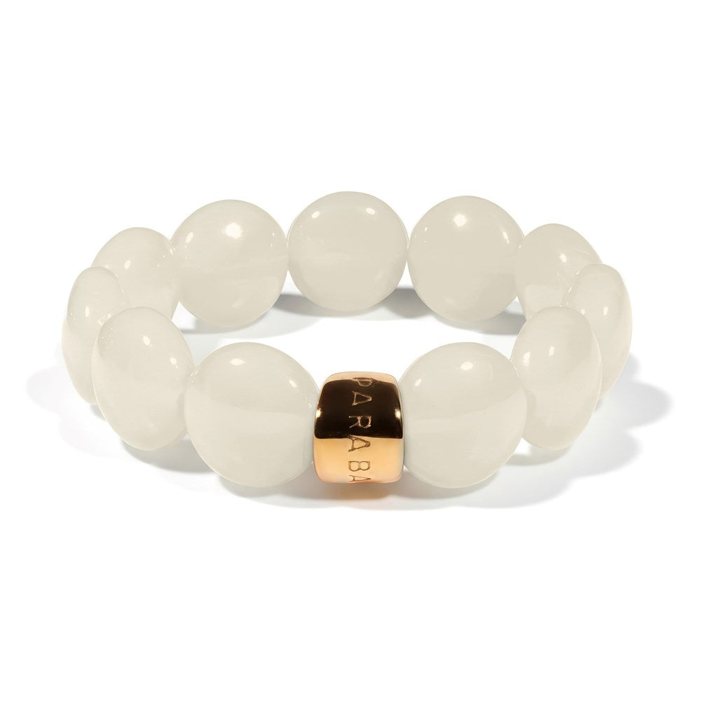 Parabaya Bombom resin bracelet with ivory beads and gold-plated signature detail on white background
