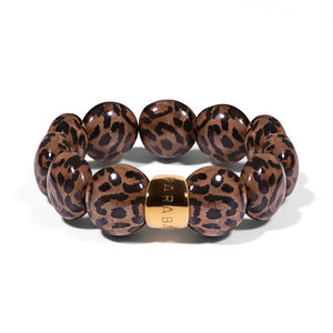 Parabaya Bombom resin bangle bracelet featuring leopard motif in hazelnut tones