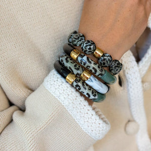 Parabaya Capi resin bangle bracelets set of 3 in khaki and leopard tones, worn stacked on the wrist