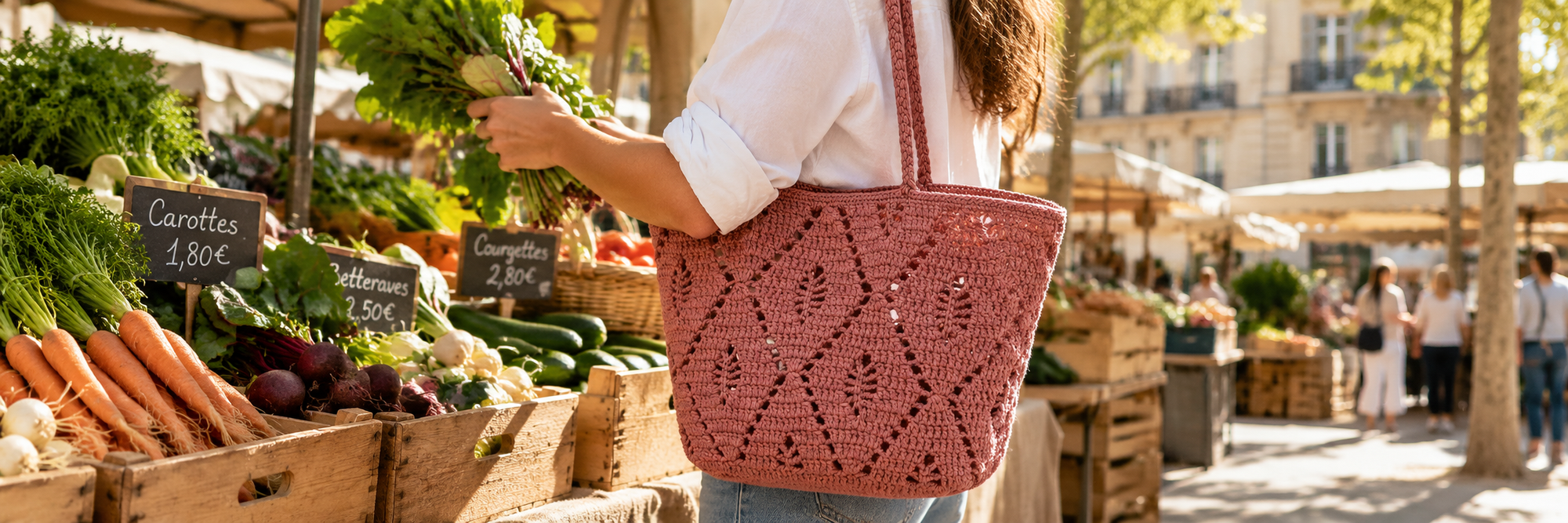 Woman carrying the Josephine rosewood crochet tote bag at a French market