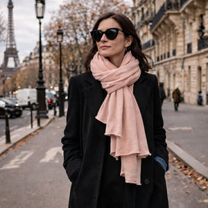 Blush pink Maison Fanli cashmere blend scarf styled on a Paris street with black coat