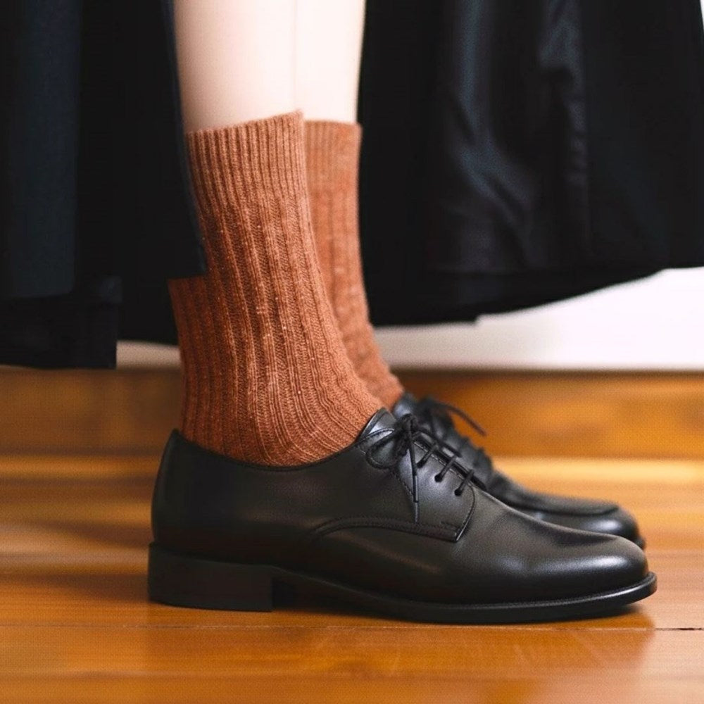 KLUE silk and wool socks in rust worn with black loafers