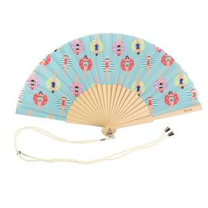 Fisura hand fan shown open with printed design "Swimmers"